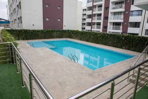 Swimming pool, Bela Getaway Homes Deluxe Studio Apartment in Athi River