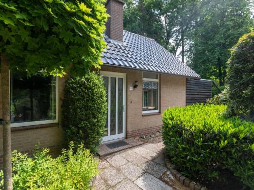  Cozy house with a fireplace in a holiday park in a natural area in Mook