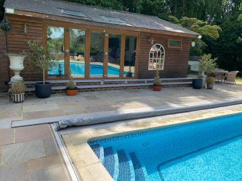 Swimming pool, 4 bedroom Lodge Hotub-Pool in Surrey UK in East Horsley