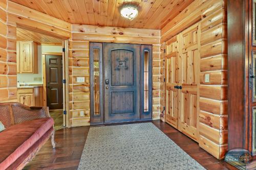 Waterfront Hand-Crafted Log Cabin - Sandy Beach - Dock - 5200 Sq Ft - Stone Fireplace - Views in Whitewater, USA