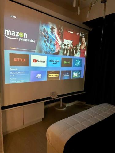 Azure 1BR with Projector - Tap to explore photos
