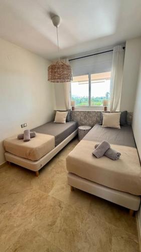 Logement vue mer, golf et jardin