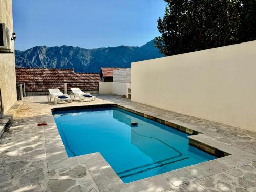 Prcanj sunny port apartments with shared pool