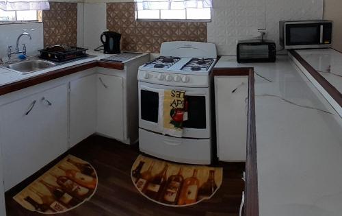 Kitchen, CozyGetAway- US Embassy, MedPlus 10 mins away in Bridgetown