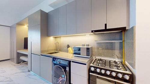 Vacationer Holiday Homes I Calm Studio Apartment l Wi-Fi, Private Balcony & Equipped Kitchen, Dubaj (fotografie 4)