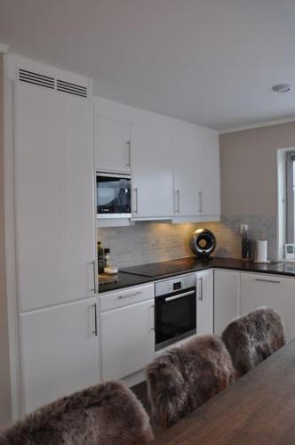 Leilighet sentralt på Sjusjøen, 11 sengeplasser (Leilighet sentralt pa Sjusjøen, 11 sengeplasser) in Sjusjoen