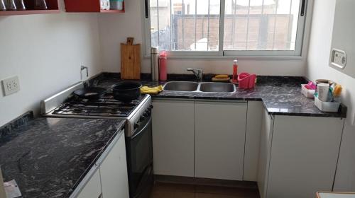 주방, Hostel Italia Fisherton in 안타르티다 아르헨티나