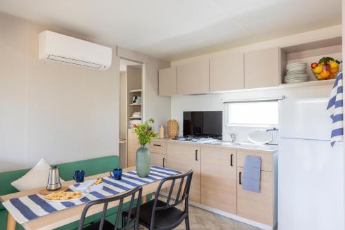 Village with swimming-pool in Montalto Marina just 100 meters from the beach, mobile homes with air conditioning and private outdoor area