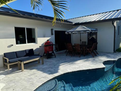 Luxury Beach Home with Heated Pool, Walk to Everything - Tap to explore photos