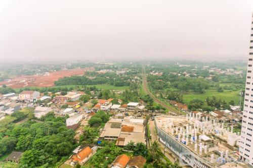Studio Room with Cozy Style at Serpong Garden Apartment By Travelio