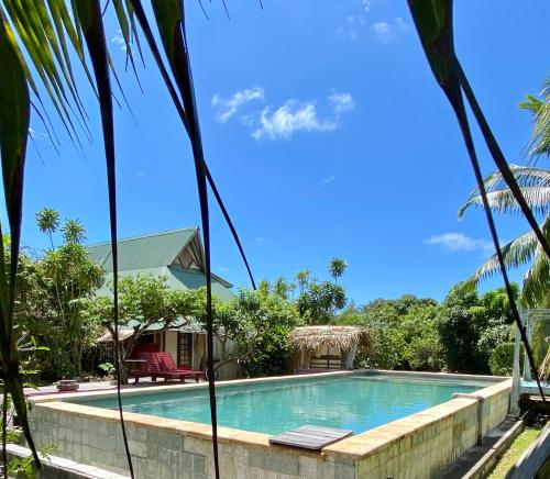Kolam renang, Rumah 75 m² dengan 2 kamar tidur dan 1 kamar mandi pribadi di Maharepa (Fare Bamboo avec PALAPA et piscine partagée) in Maharepa