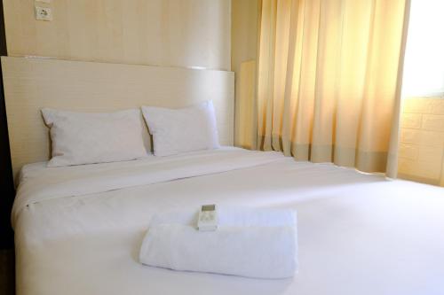 Cozy 2BR Apartment at Suites @ Metro By Travelio