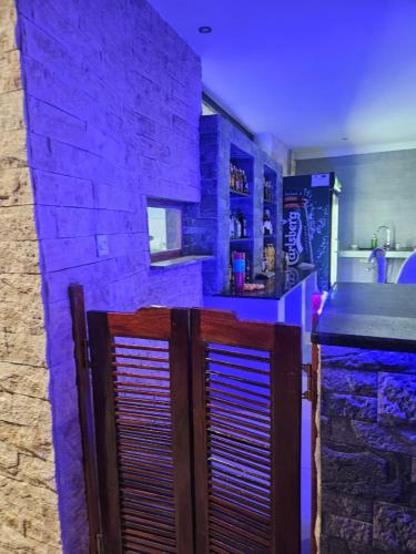 Bar/ Salón, Bougainvillea Beach Villa in Club Makokola