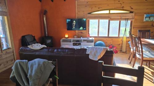 Felles stue/TV-område, Cabaña MISUEÑO (Cabana MISUENO) in Punta del Diablo