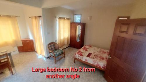 Spacious Groundfloor apartment 150m- public beach- AC both rooms - Tap to explore photos