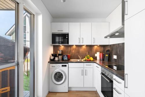 Kitchen, Maltes-Ostseekoje Parken frei vorm Haus, 500m zum Strand,Infrarotsauna,Magenta TV mit Netflix ,Disne in Olpenitz