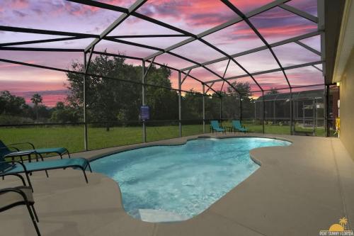 BellaVida Palms Private Screened Pool Home image