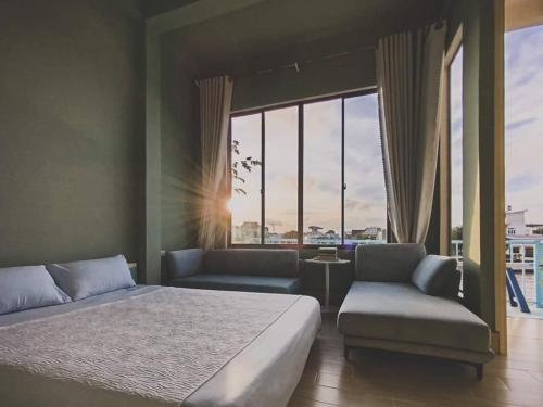 Here Library - A wooden home by the river with a library