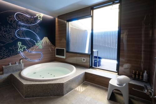 Hot spring bath, Hotel HOQA Hanaironoyu in Minami