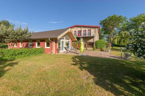 Pohled zvenku, Wildgans - Stilvolles Ferienhaus mit Terrasse, Seeblick & Naturidylle am Loppiner See in Jabel