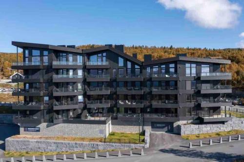 Riddertunets utsikt til Mugnetind in City Center