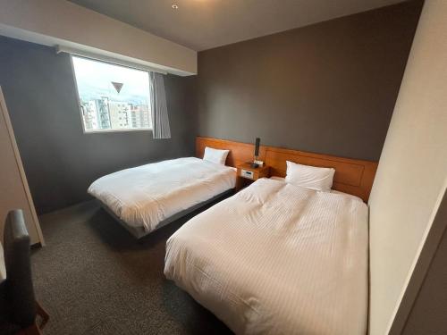 Twin Room - Smoking room in Hotel Route Inn Kanazawa Ekimae