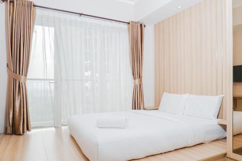 Clean and Elegant 1BR at The Oasis Apartment By Travelio, Cikarang