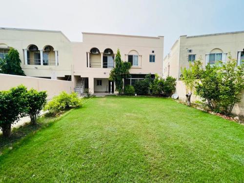 Haven Lodge Lahore by Haven Holiday Homes - 4BR Vacation Home with Lawn & Park Access