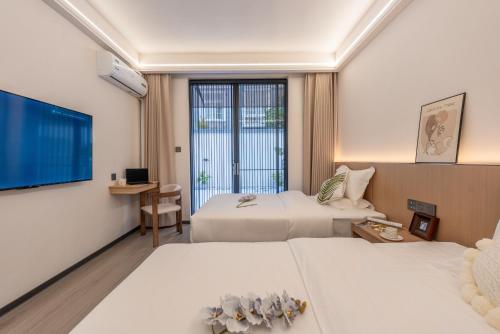 Courtyard Twin Room room in Lane Wisdom Garden Hotel - Lijiang Ancient City Zhongyi Market