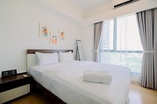 Modern Look 2BR at Sky House BSD Apartment By Travelio, Tangerang