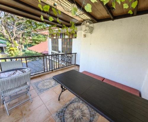 Balcony/terrace, Cozy Las Pinas Haven with Big Garden, Pet Friendly - Near Super Market and the Airport near SM Center Las Piñas