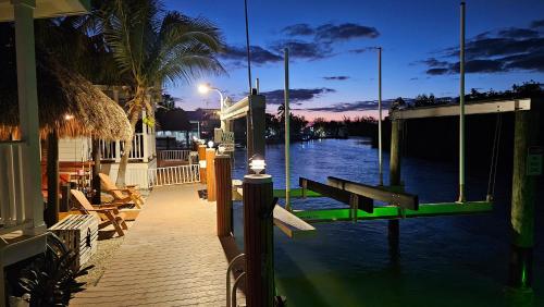 Kokomo - Waterfront Tiny House and Tiki with Boat Ramp and Lift - Tap to explore photos