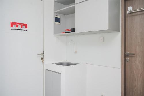 Warm and Simply Studio Room at Urbantown Serpong Apartment By Travelio