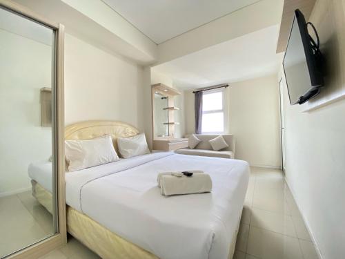 Homey Furnished 2BR Apartment at Parahyangan Residence By Travelio, Bandung