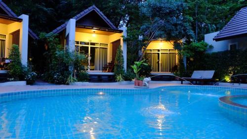 Swimming pool, Baan Klang Aow Beach Resort near Pramaha Tat Jede Pukde Prakad