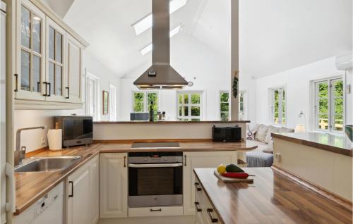 Kitchen, Three-Bedroom Holiday Home In Hojby in Hojby