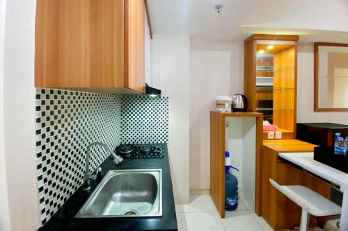 Restful and Tidy 2BR Apartment Springlake Summarecon Bekasi By Travelio