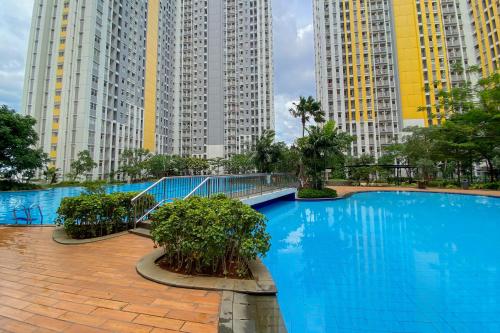Restful and Tidy 2BR Apartment Springlake Summarecon Bekasi By Travelio