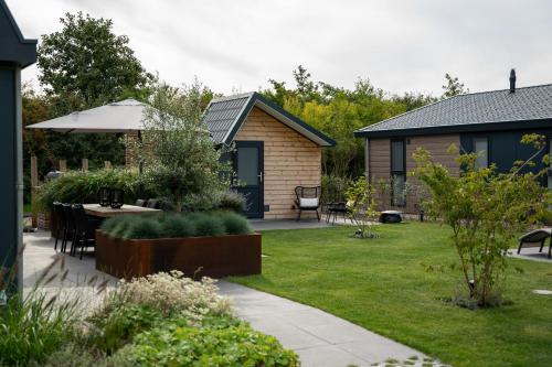 Garden, Que Vida, Boutique Chalet aan Zee en Meer in Scharendijke