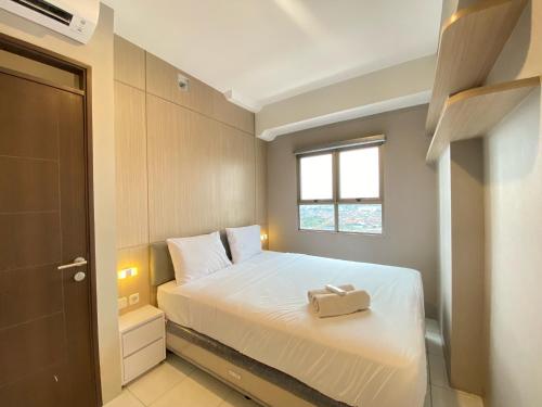 Well Furnished and Private 2BR Mekarwangi Square Cibaduyut Apartment By Travelio