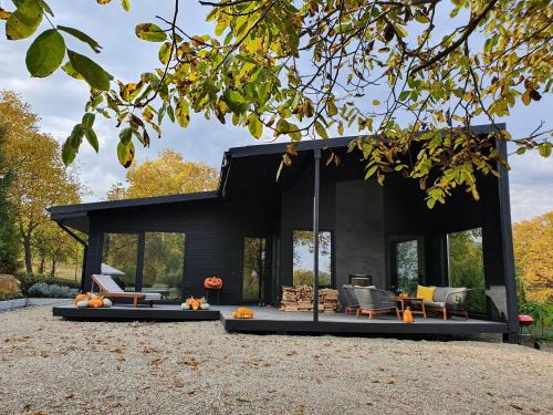 Black Walnut House with indoor outdoor fireplace