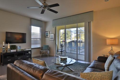SERENITY 3 Bed 3 Bath Townhome with Pool, Private Balcony, Clubhouse, Communal Pool, Conservation View, Disney 15 mins by Orlando Holiday Rental Homes LLC 17401 in Orlando, USA