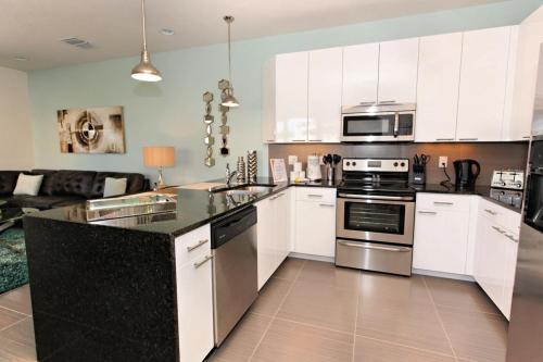 SERENITY 3 Bed 3 Bath Townhome with Pool, Private Balcony, Clubhouse, Communal Pool, Conservation View, Disney 15 mins by Orlando Holiday Rental Homes LLC 17401 in Orlando, USA