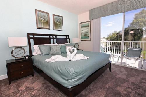 SERENITY 3 Bed 3 Bath Townhome with Pool, Private Balcony, Clubhouse, Communal Pool, Conservation View, Disney 15 mins by Orlando Holiday Rental Homes LLC 17401 in Orlando, USA