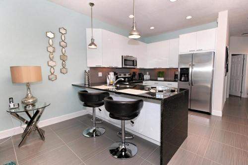 SERENITY 3 Bed 3 Bath Townhome with Pool, Private Balcony, Clubhouse, Communal Pool, Conservation View, Disney 15 mins by Orlando Holiday Rental Homes LLC 17401 in Orlando, USA