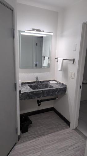 Queen Room with Two Queen Beds room in Evergreen Inn & Suites Portland Airport