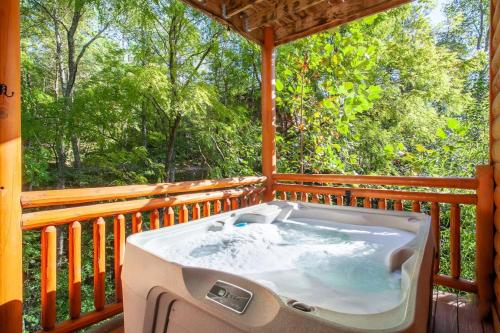 2Cabins Sleeps 26 12BR Pool HotTub Theater Games in Sevierville, USA
