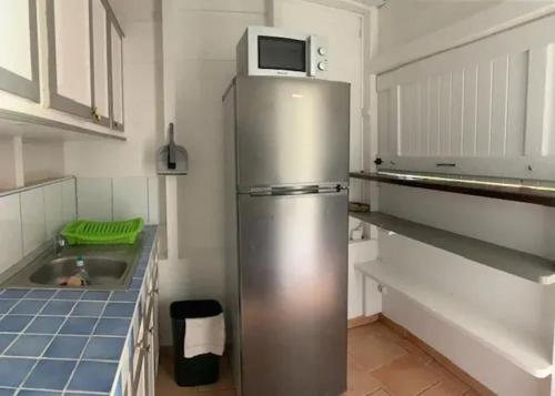 ห้องครัว, Bungalow accueillant à Le Diamant avec piscine partagée (Bungalow accueillant a Le Diamant avec piscine partagee) in เลอ ยามัน