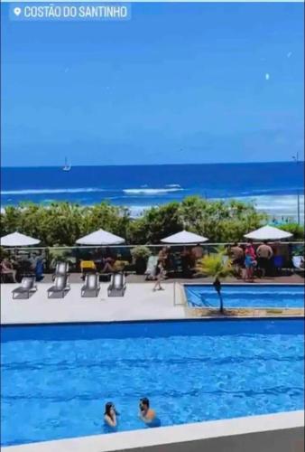สระว่ายน้ำ, Aguas do Santinho Residence - Vista Mar in หาดซานติงโย