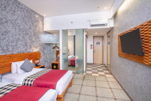 The 1O1 Bandung Dago Room Type - Deluxe Twin Room